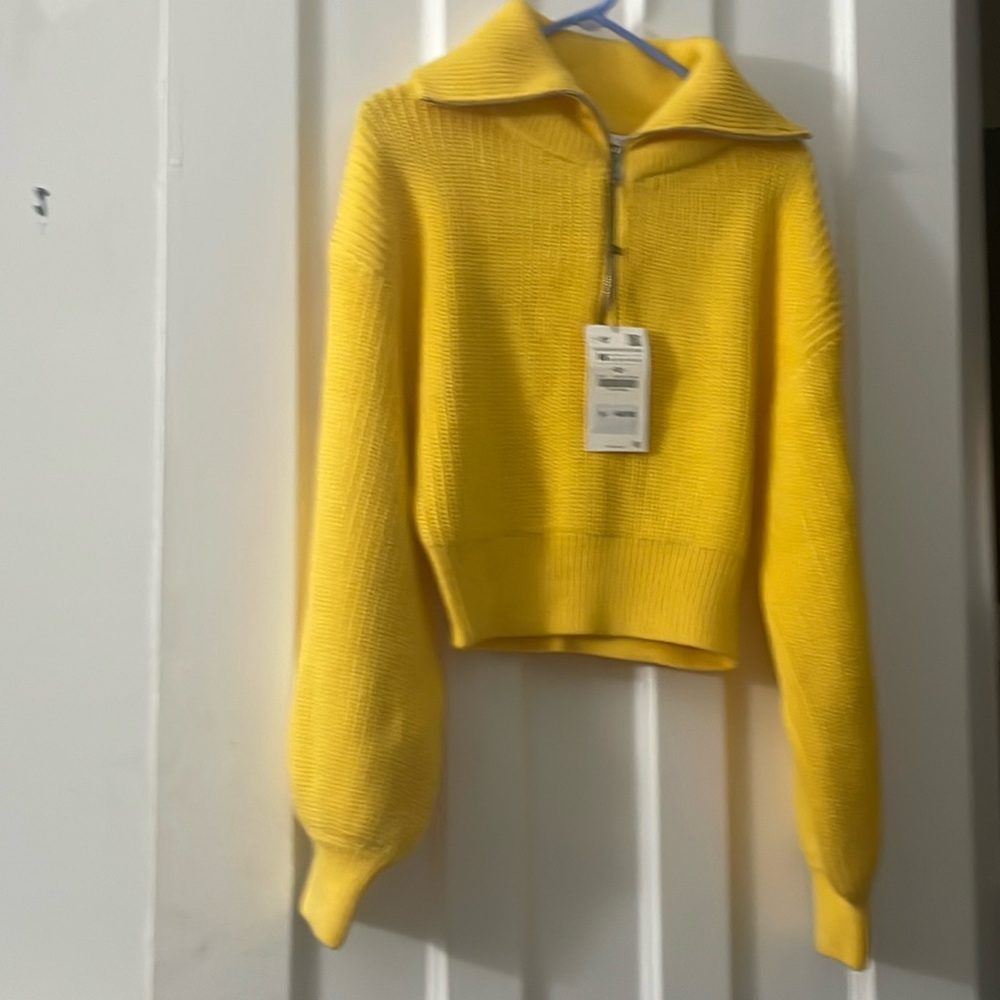 Waist length chunky knit sweater